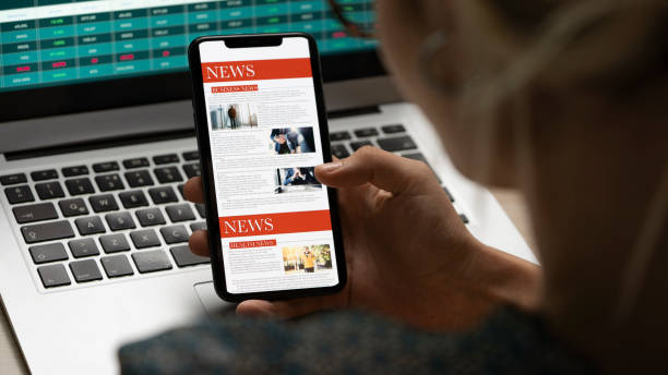 istock Reading news on mobile phone 1340561178