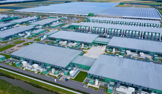 drone  aerial view of new Microsoft datacenters . The huge buildings are located along highway A7 in the province Noordholland near Wieringerwe