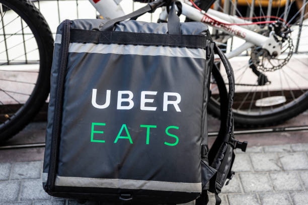 Uber Eats backpack next to a bike stock photo