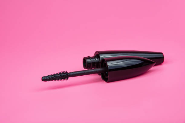 istock Black tube mascara for lashes make up on pink background 1340574309
