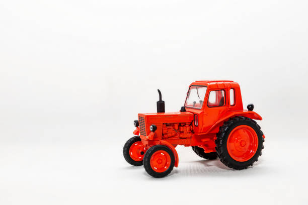 istock Red toy tractor on a white background 1340575271