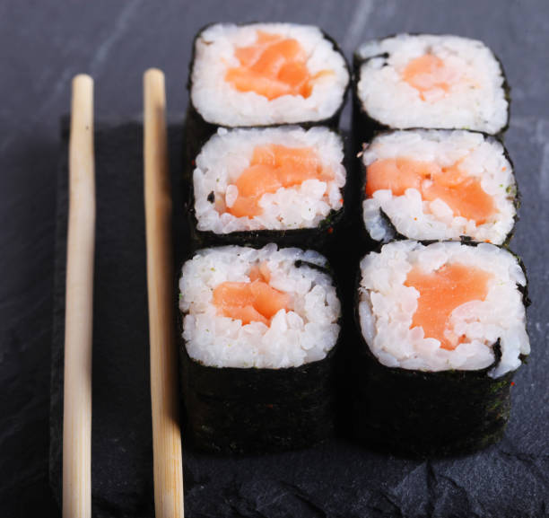 istock Maki rolls with over grey background. Japanese Sushi. close up 1340575652