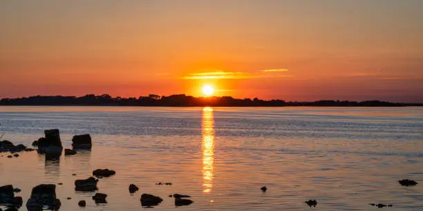 The sun setting on a clam evening at Lough Ree in Ireland