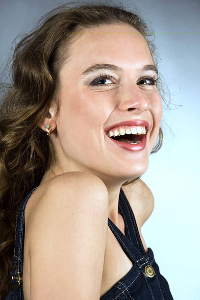 Portrait of a smiling pretty young girl with long hair stock photo