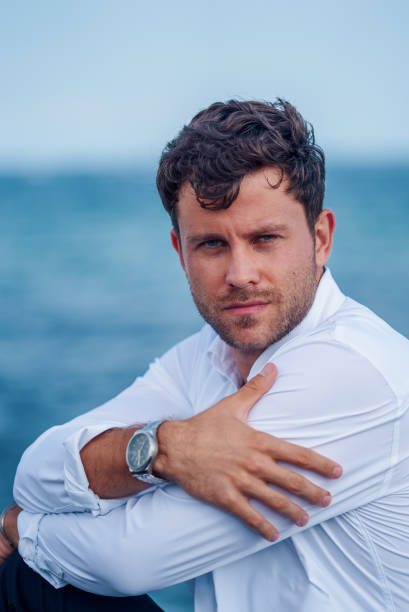 istock Thoughtful man on seashore in summer 1340585362