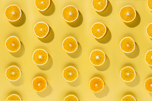 istock Orange slices on an orange background 1340585408