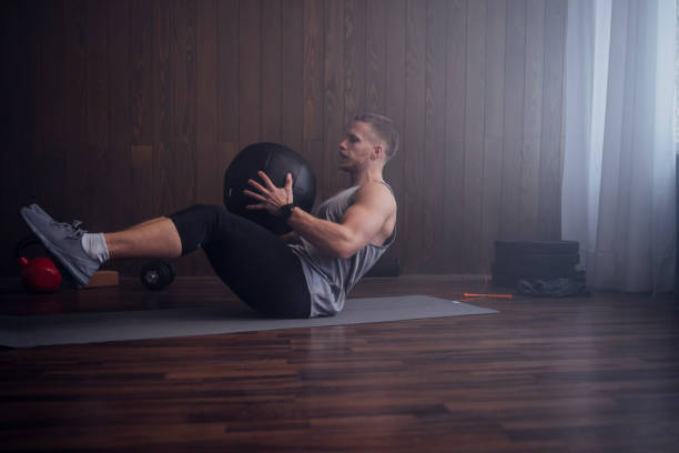 istock Handsome Blond Man Exercising at the Gym 1340585506