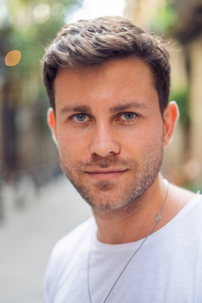 istock Stylish bearded millennial man looking at camera 1340586433