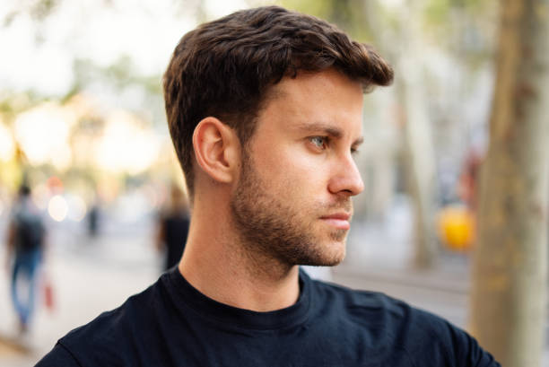 istock Young man with stylish haircut in city 1340586459