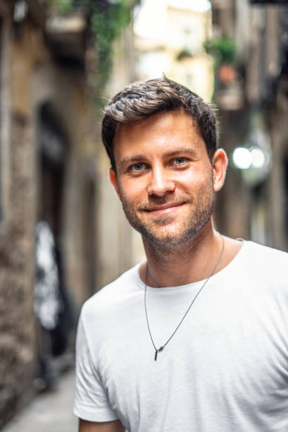 istock Happy young man on urban street 1340587352