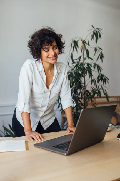istock Smiling Business Woman Talking on Video Call 1340589256