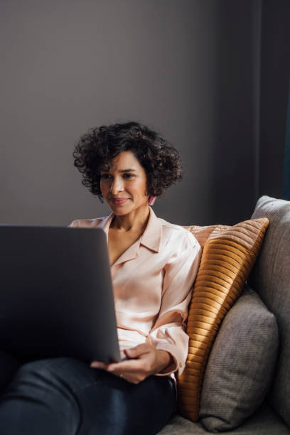istock Smiling Woman Talking on Video Call with Friend 1340589298