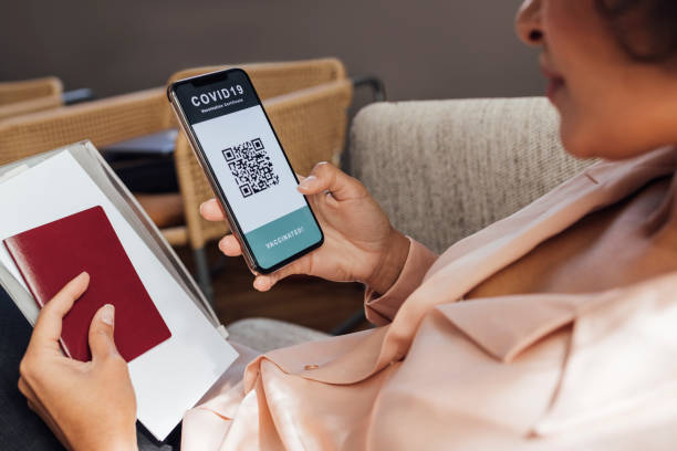 istock An Anonymous Woman Using Digital Passport App on Mobile Phone 1340589309