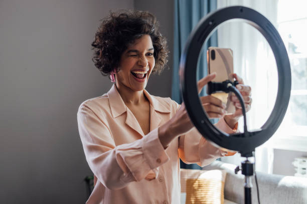 istock Cheerful Woman Vlogging at Home 1340589311