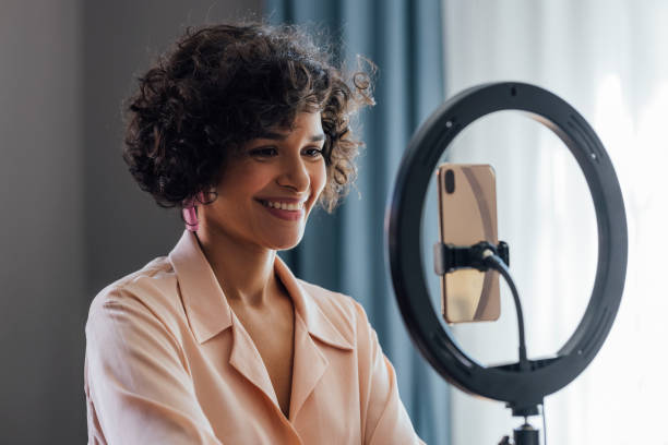 istock Cheerful Woman Vlogging at Home 1340589319