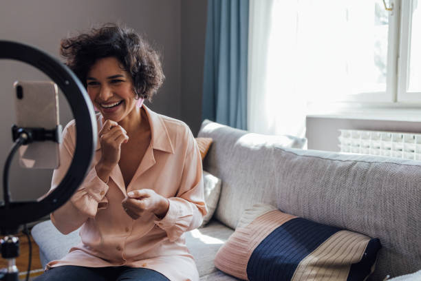 istock Cheerful Woman Vlogging at Home 1340589322