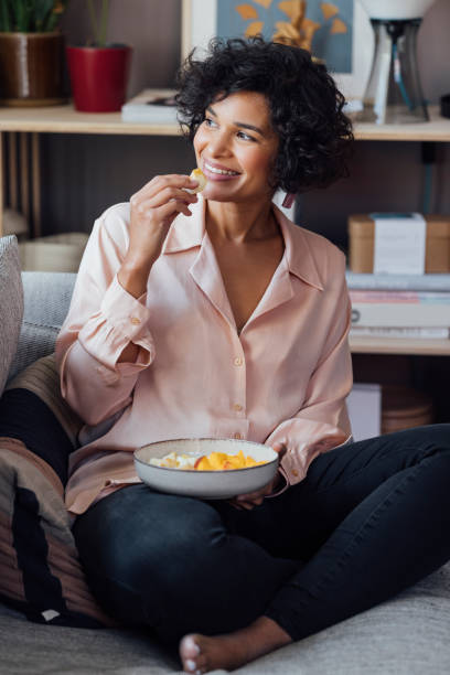 istock Beautiful Woman Eating Breakfast at Home 1340589340