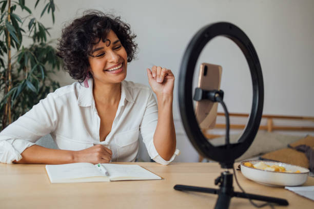 istock Cheerful Woman Vlogging at Home 1340589348