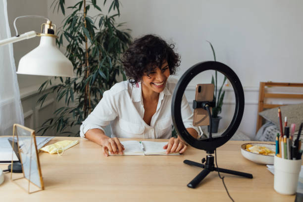 istock Cheerful Woman Vlogging at Home 1340589355
