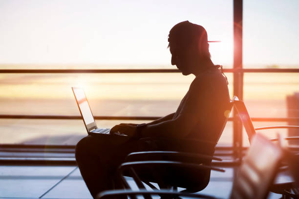 istock Man is working on a laptop at the airport. 1340590469