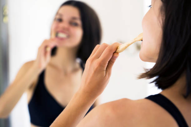 istock Woman carefully looks after her teeth. 1340592456