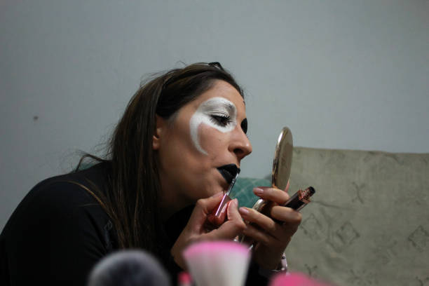 istock young woman doing a scary makeup for Halloween 1340599055