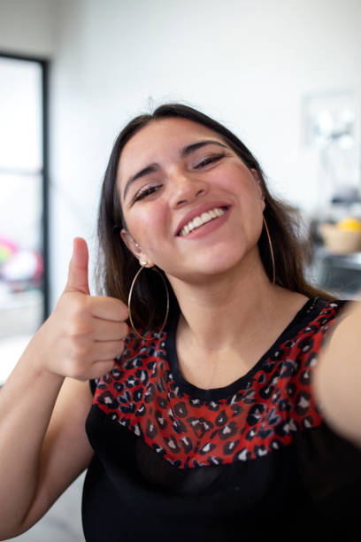 istock young woman taking selfie 1340599853
