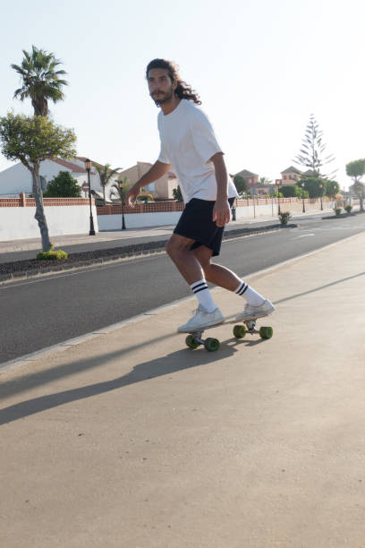 istock Young male surfskating on the street 1340603821