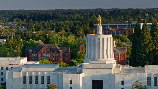 istock Pioneer Satue on Oregon State Capitol Building Shining in Evening Light 1340606038