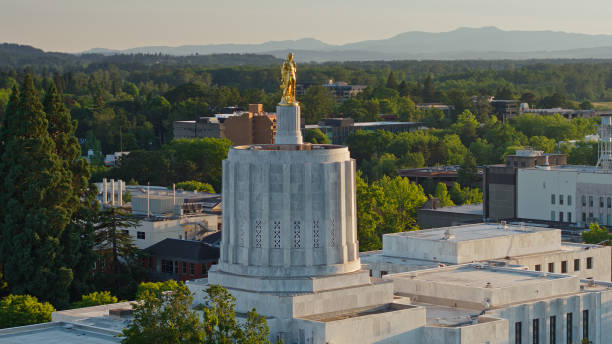 istock Oregon Pioneer Atop State Capitol Building with Mountains Beyond 1340606043