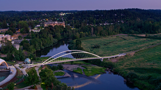 Aerial shot of Salem, Oregon on a summer night, looking across the Willamette River and Riverfront City Park towards Minto Island.\n\nAirspace authorization was obtained from the FAA for this operation.