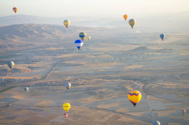 istock Balloon in the sky with people in Cappadocia 1340611167