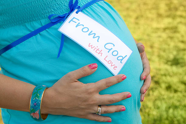 istock Pregnant Mom Holding Tummy 134061416