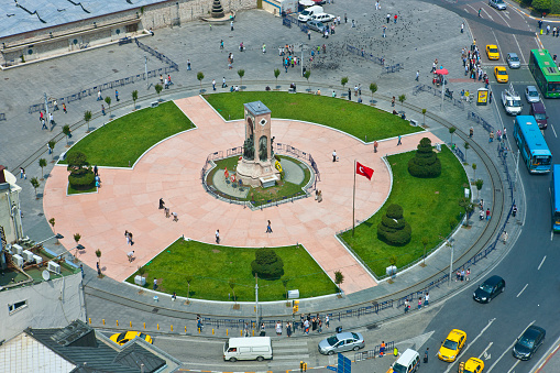 Istanbul, Turkey - 01 July, 2010: Gardens and statue view of famous Taksim Republic Monument and Taksim Square in Istanbul, Turkey