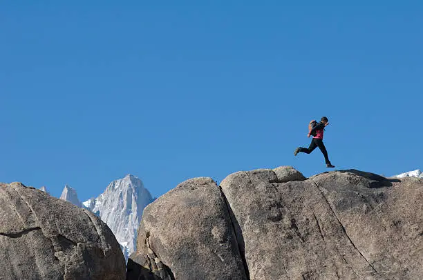 A man running across the rocks
