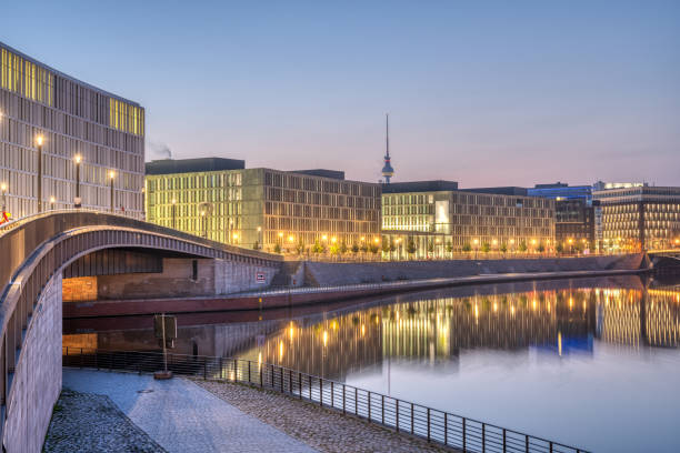Early in the morning at the river Spree in Berlin Early in the morning at the river Spree in Berlin with the Television tower in the back riverbank photos stock pictures, royalty-free photos & images