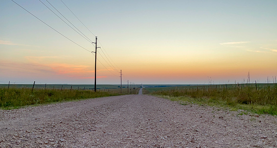 Sunset down a dirt road near a farm in Eureka, Kansas