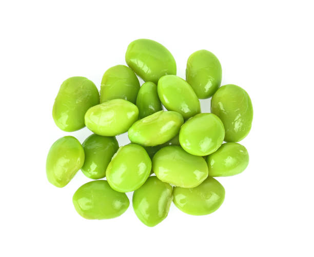 istock Top view of green soybeans on white background 1340639114