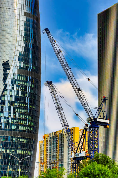 istock Tower crane in the middle of the building complex 1340639293