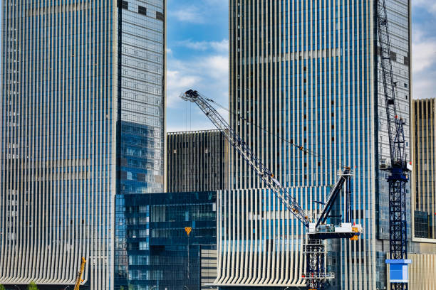 istock Tower crane in the middle of the building complex 1340639479