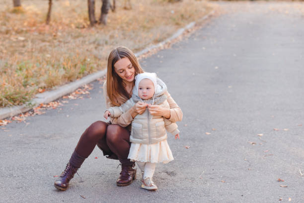istock a woman puts on a child's hat 1340647471