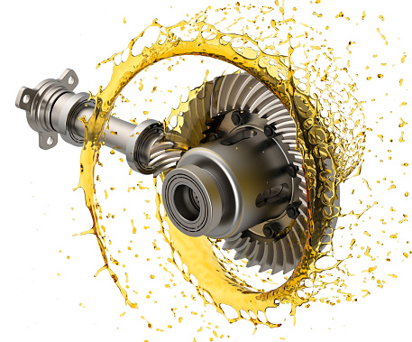 Differential gears with oil. The differential oil lubricates the ring and pinion gears that transfer power from the driveshaft to the wheel axles.