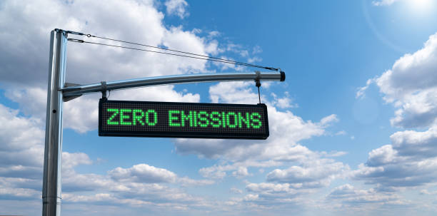 Road information board with text ZERO EMISSIONS Road information board with text ZERO EMISSIONS on a background of blue sky. Clean mobility concept low carbon economy stock pictures, royalty-free photos & images