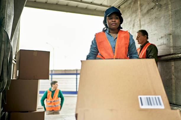 istock Young Female Truck Driver Loading Merchandise 1340649480