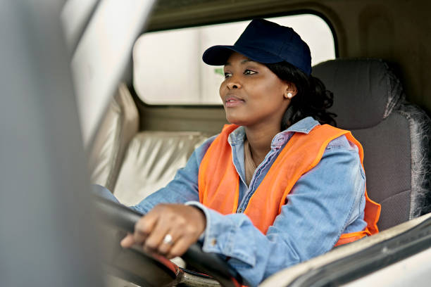istock Mid 20s Female Truck Driver Sitting in Cab 1340650004
