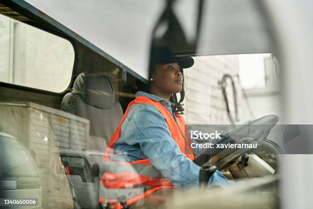 Black Female Truck Driver Photographed Through Window Stock Photo - Download Image Now