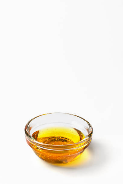 istock Healthy organic honey in a bowl on white background. 1340652028