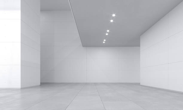 istock Large museum gallery with empty white walls and bright light 1340652201