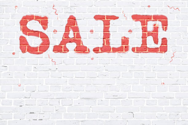 istock White coloured brick wall making a  rustic poster with text SALE painted on the bricks in red colour with small swirls pattern, vector backgrounds 1340653460