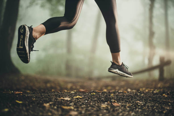 istock Unrecognizable athlete running during bad weather conditions. 1340654483